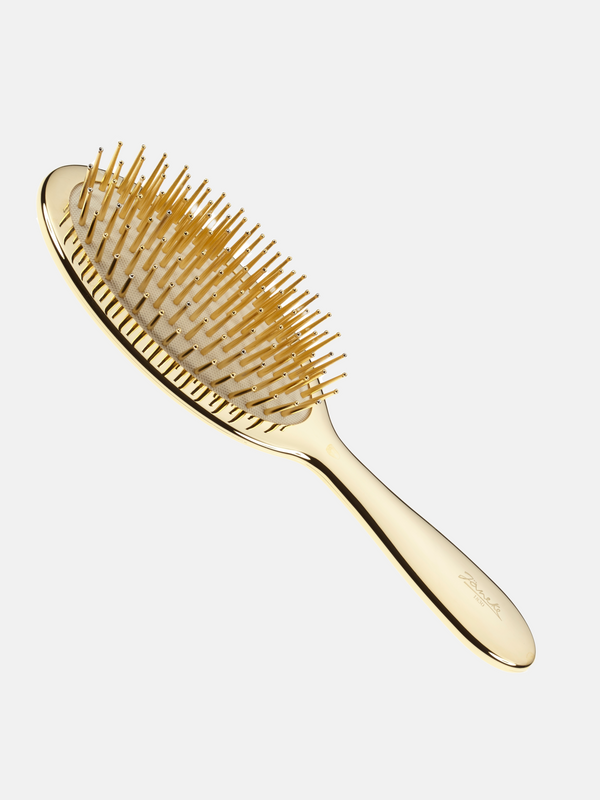 Air- cushioned brush with gold pins